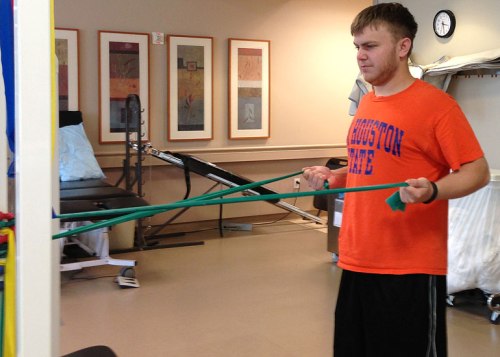 The kid works the bands during his first physical therapy session yesterday.
