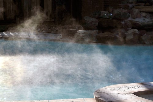 Steam rises in the cold air from our swimming pool.