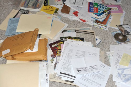 Shredding, recycling, and need-to-organize piles are on my office floor.