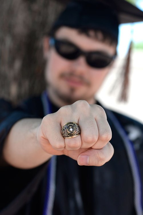 Jake shows off his class ring Green Lantern style.