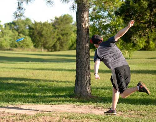 I’m back shooting disc golf now that my thumb joint feels better. Here C.J. tees off.